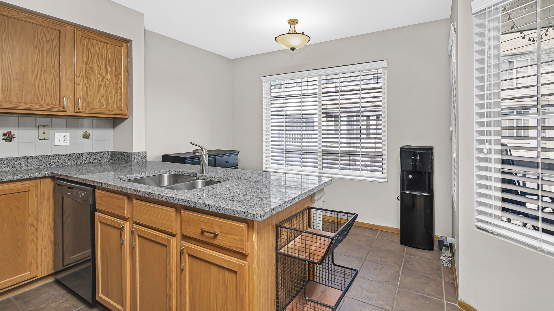 3159 Cambria Court Aurora, IL 60503 - Photo 4 of 21 a kitchen with stainless steel appliances granite countertop a sink and cabinets