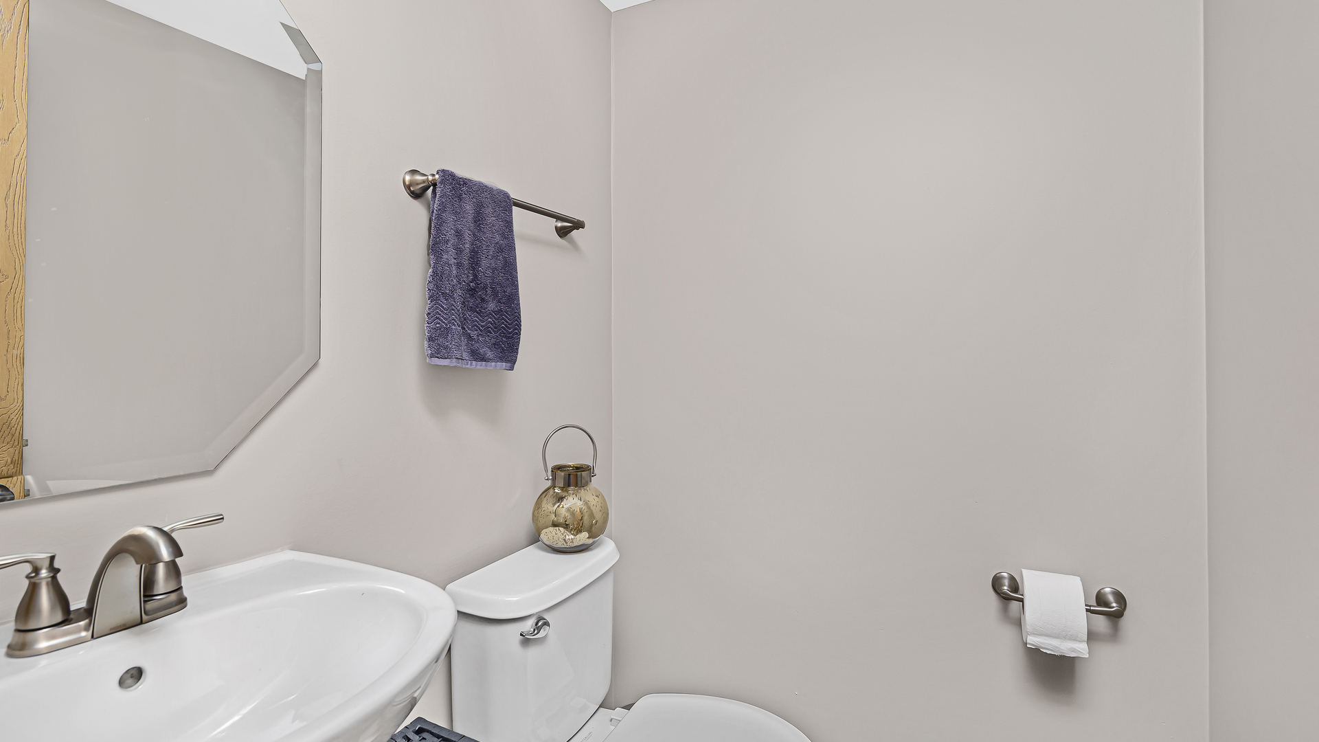 3159 Cambria Court Aurora, IL 60503 - Photo 8 of 21 a bathroom with a toilet sink and mirror