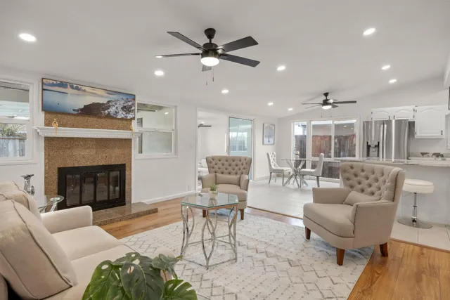 a living room with furniture and a fireplace