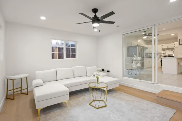 a living room with furniture and a large window