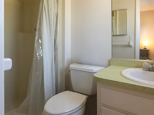 a bathroom with a sink and toilet