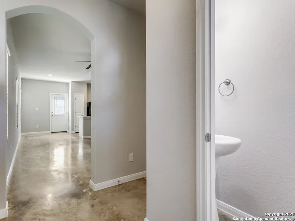 a view of a bathroom from a hallway