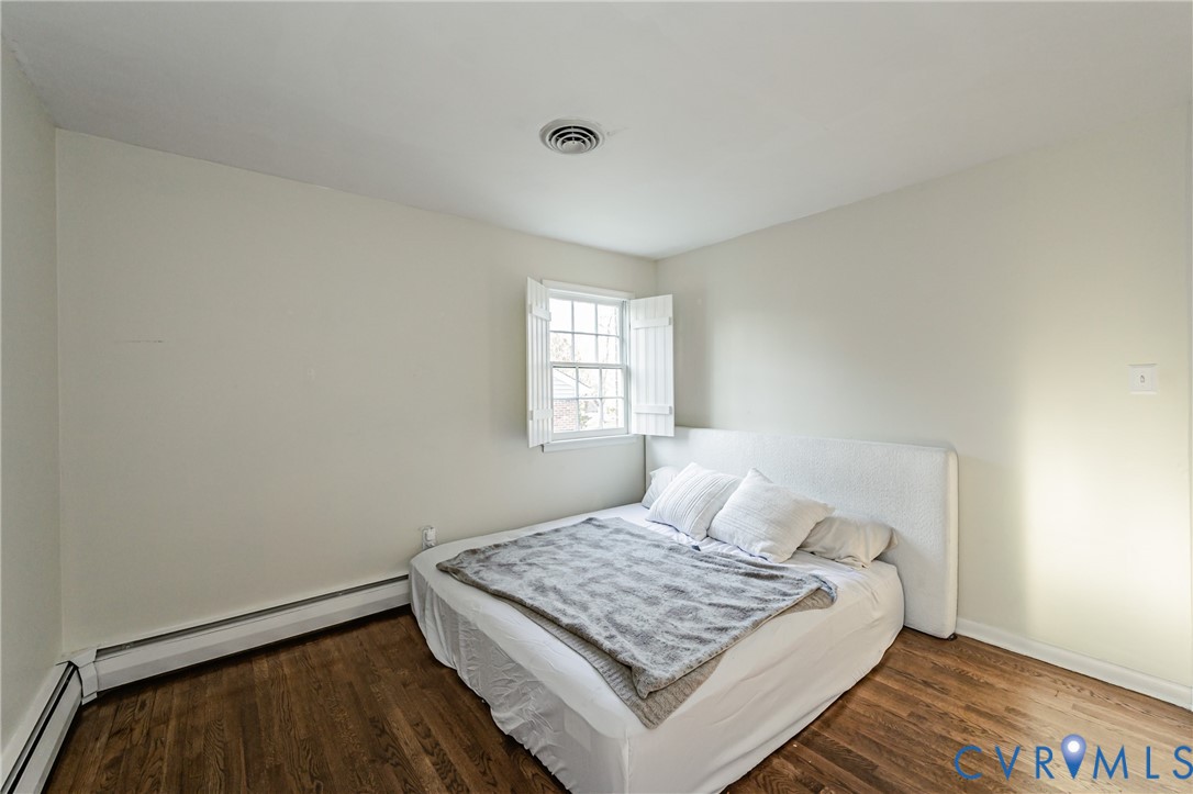 6048 Gainford Road Richmond, VA 23234 - Photo 19 of 83 Bedroom with baseboard heating and dark wood-style
