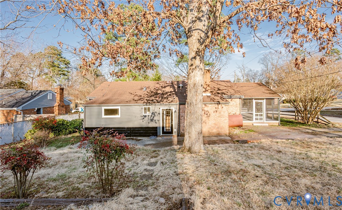 6048 Gainford Road Richmond, VA 23234 - Photo 28 of 83 Back of house featuring a sunroom, a patio area, a
