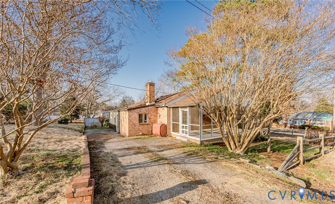 6048 Gainford Road Richmond, VA 23234 - Photo 35 of 83 View of front of home with a chimney, a sunroom, h