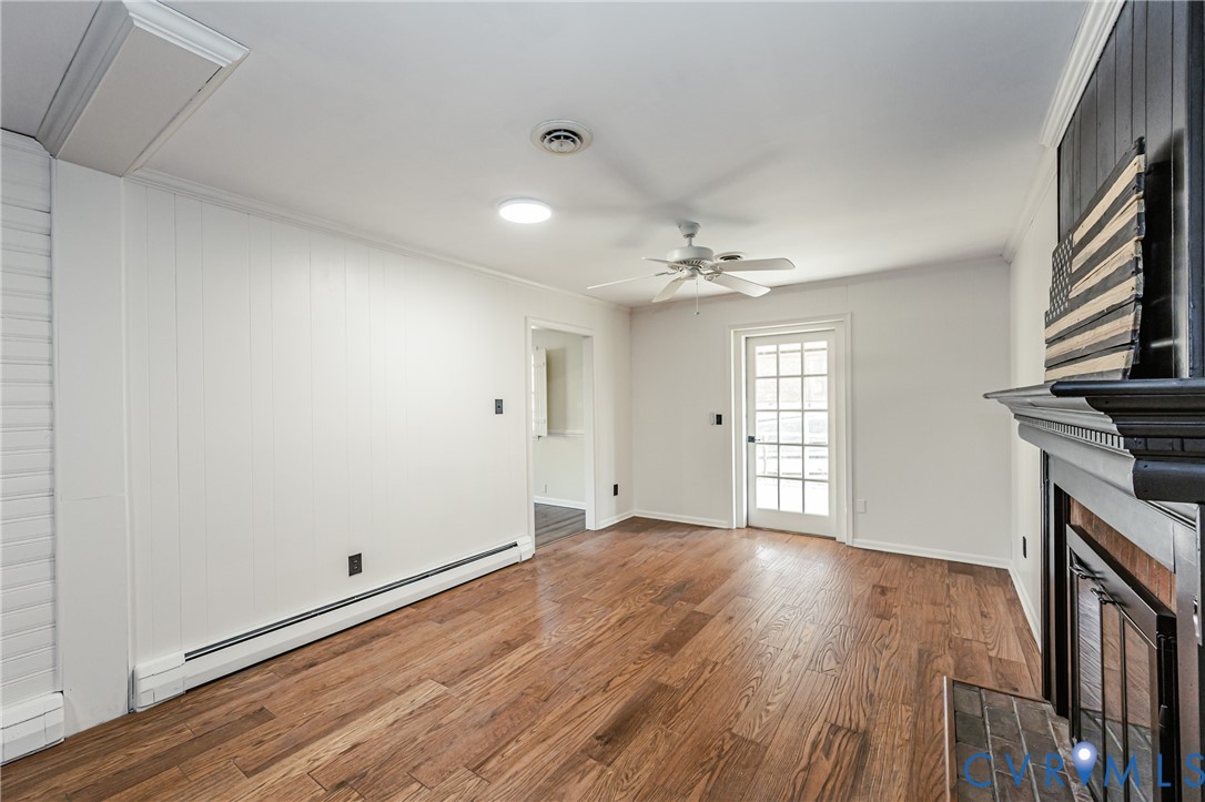 6048 Gainford Road Richmond, VA 23234 - Photo 50 of 83 Unfurnished living room with a baseboard radiator,