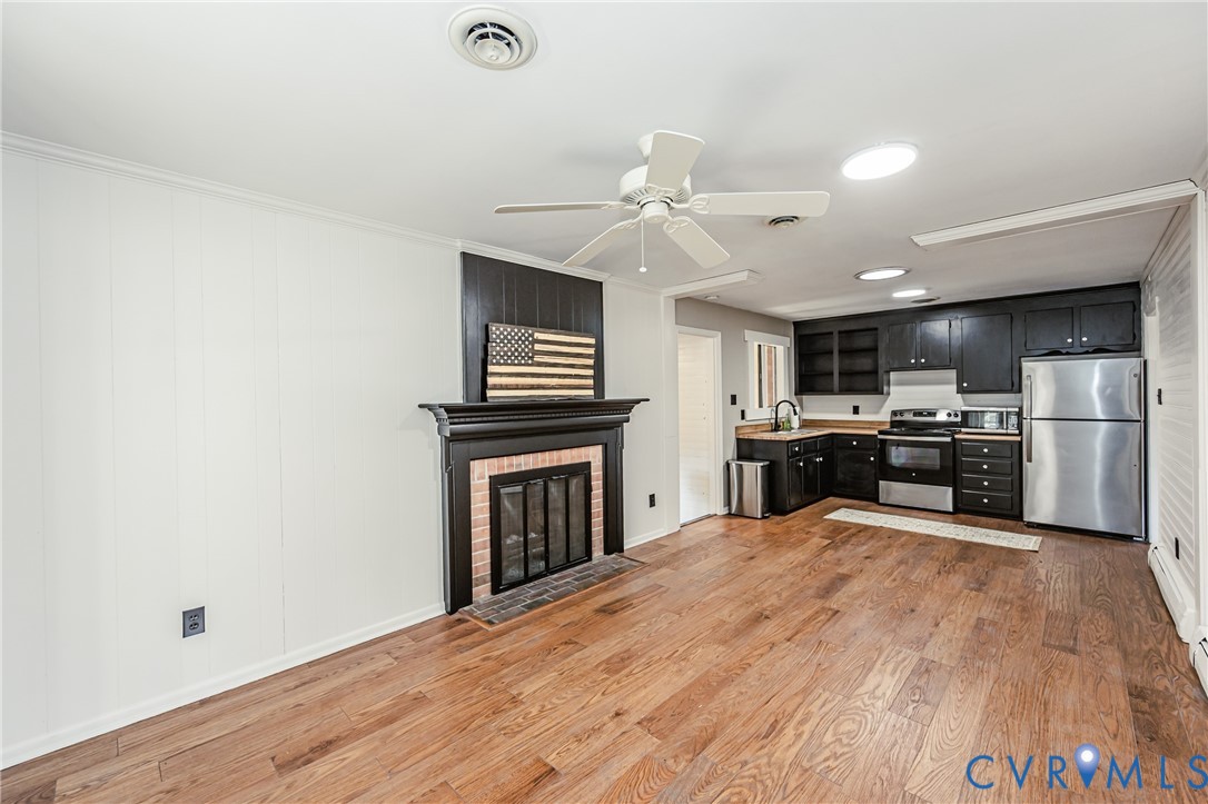6048 Gainford Road Richmond, VA 23234 - Photo 52 of 83 Kitchen with dark cabinets, a ceiling fan, stainle