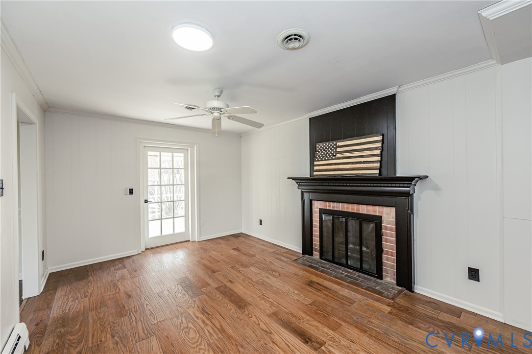 6048 Gainford Road Richmond, VA 23234 - Photo 53 of 83 Unfurnished living room featuring ornamental moldi