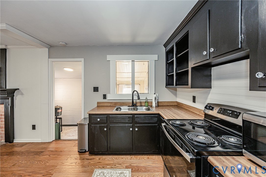 6048 Gainford Road Richmond, VA 23234 - Photo 57 of 83 Kitchen featuring dark cabinets, stainless steel a