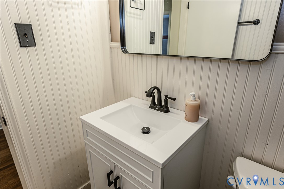 6048 Gainford Road Richmond, VA 23234 - Photo 74 of 83 Half bathroom with vanity and toilet