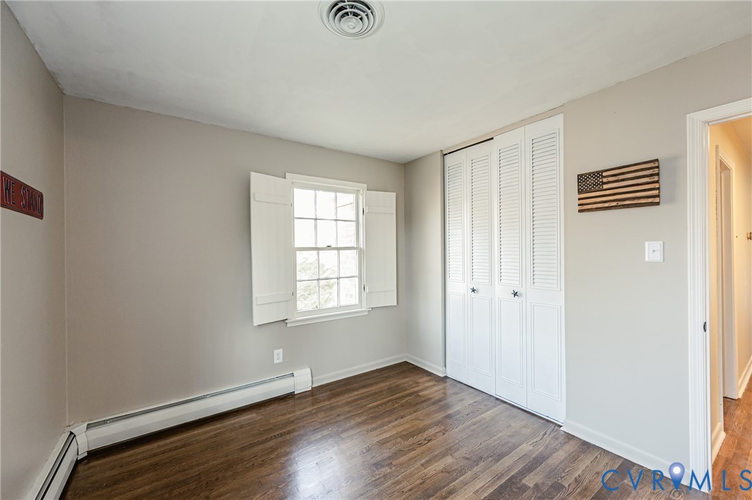 6048 Gainford Road Richmond, VA 23234 - Photo 77 of 83 Unfurnished bedroom featuring dark wood-style floo