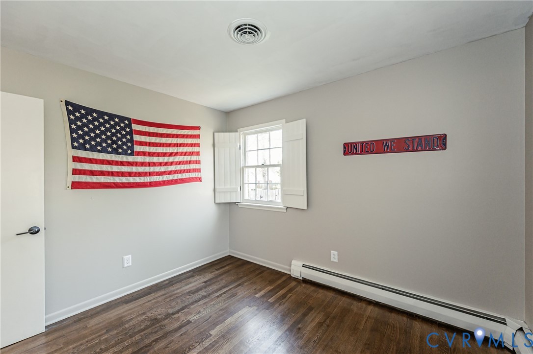 6048 Gainford Road Richmond, VA 23234 - Photo 79 of 83 Spare room with a baseboard heating unit and dark