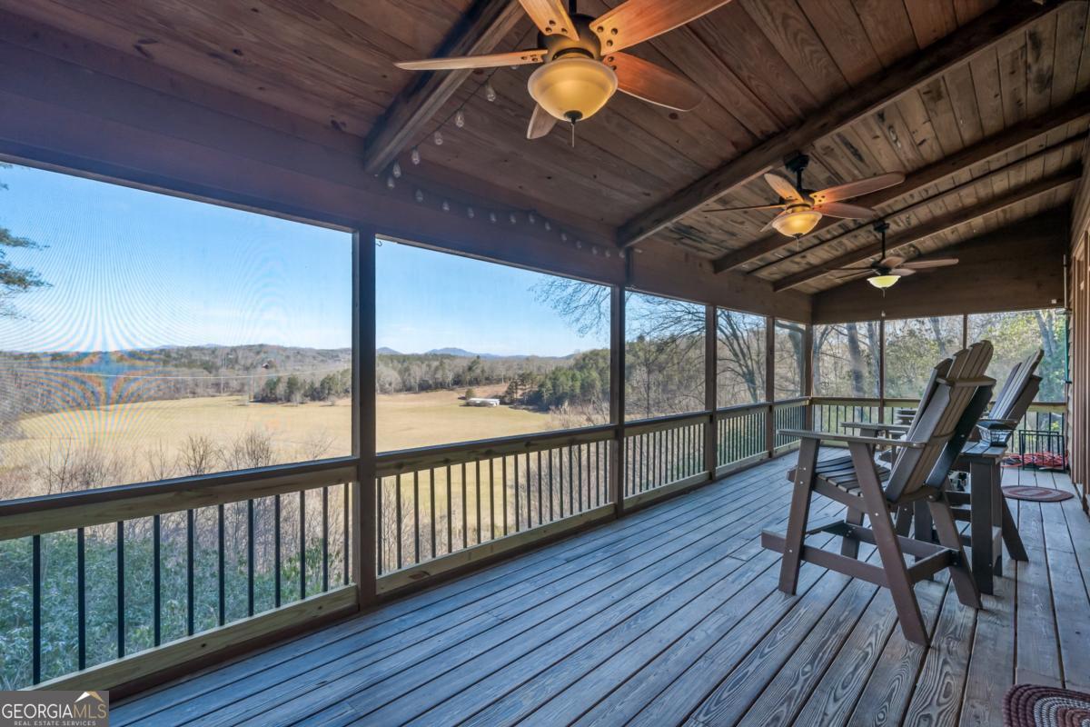 517 Ridge Road Blue Ridge, GA 30513 - Photo 17 of 56 a view of a balcony with chairs