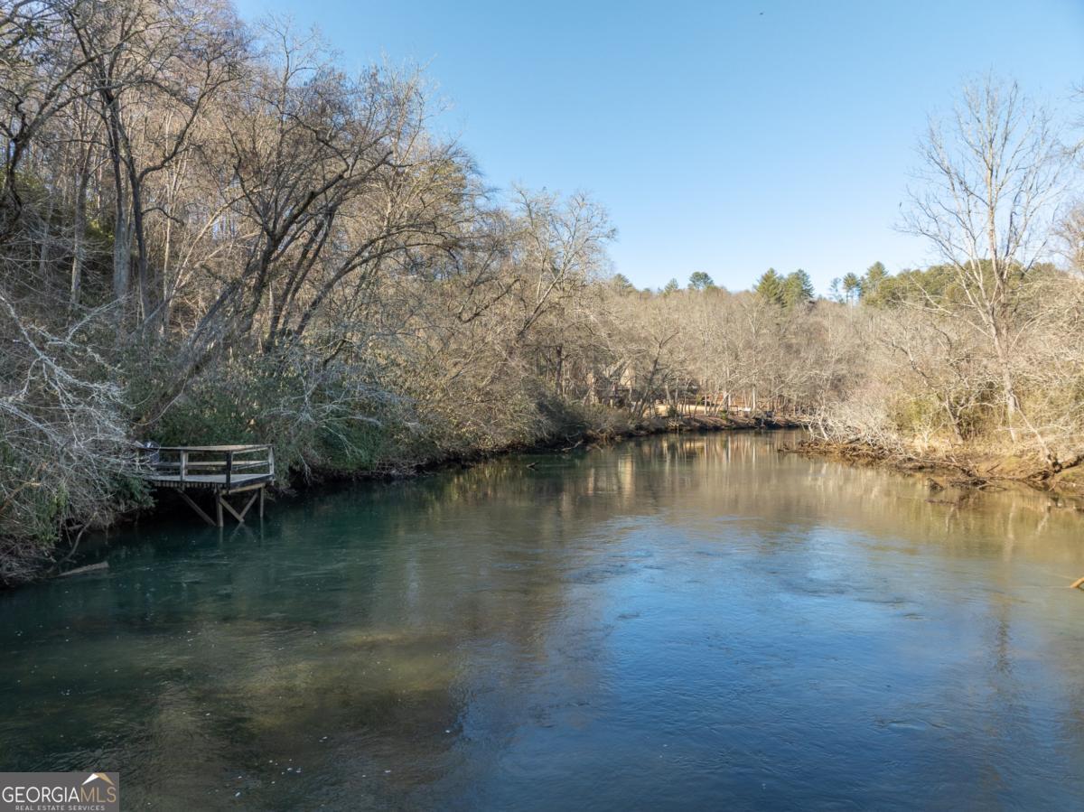 517 Ridge Road Blue Ridge, GA 30513 - Photo 3 of 56 a view of a lake with a mountain in the background