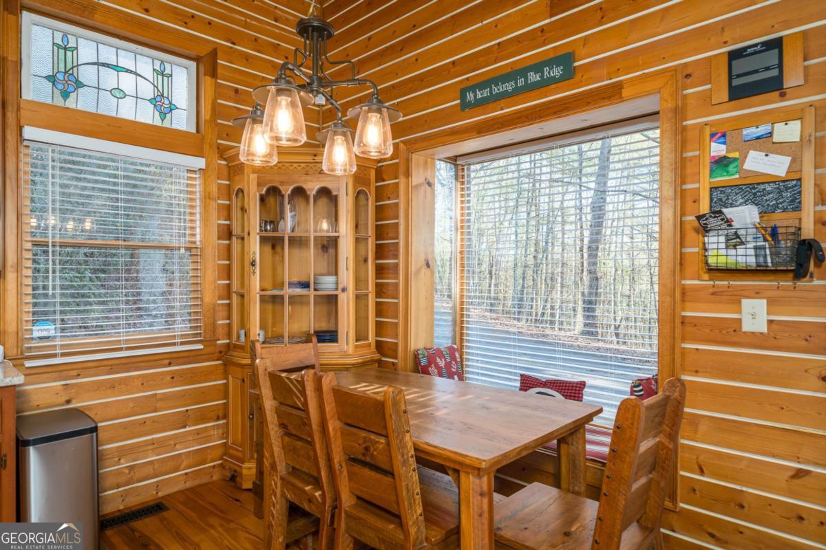 517 Ridge Road Blue Ridge, GA 30513 - Photo 10 of 56 a view of a balcony with a table and chairs