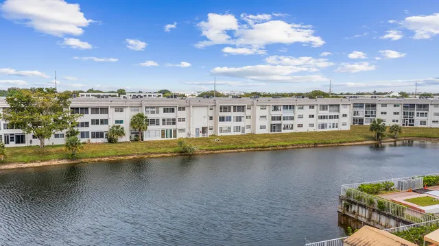 a view of a swimming pool with outdoor seating
