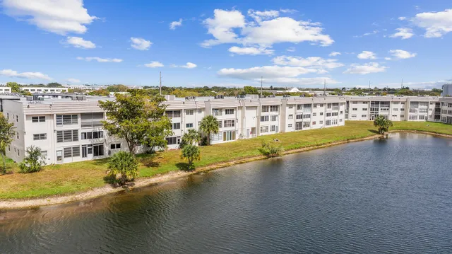 a view of a lake with houses in the back