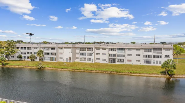 a view of a lake with houses in the back