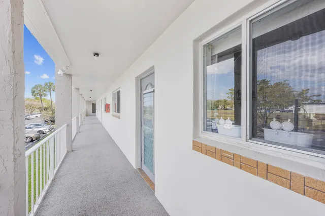 a view of a hallway with windows