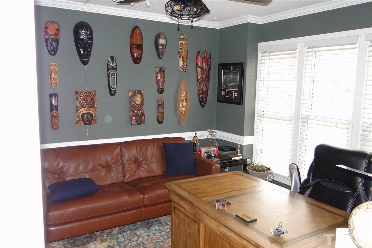 4105 Landrum Lane Raleigh, NC 27616 - Photo 14 of 29 a living room with a couch and a table