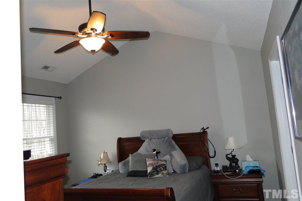 4105 Landrum Lane Raleigh, NC 27616 - Photo 19 of 29 a bedroom with a bed and window