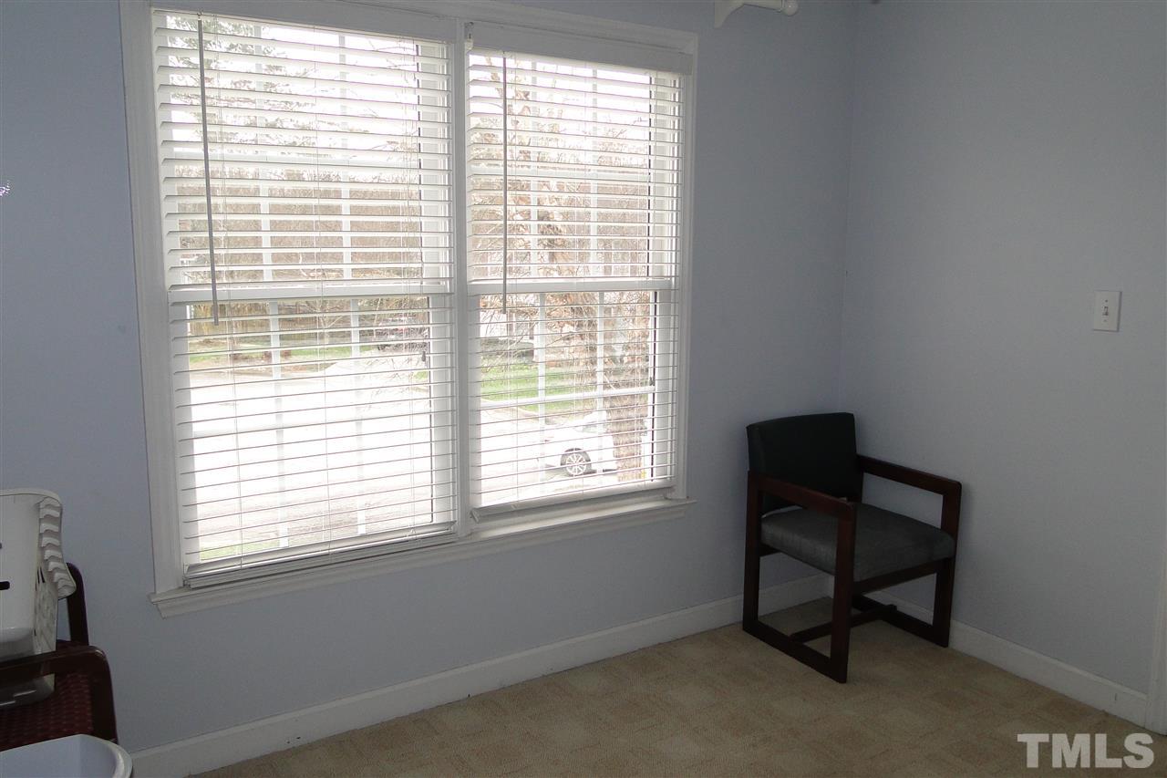 4105 Landrum Lane Raleigh, NC 27616 - Photo 23 of 29 a room that has a window and a chair