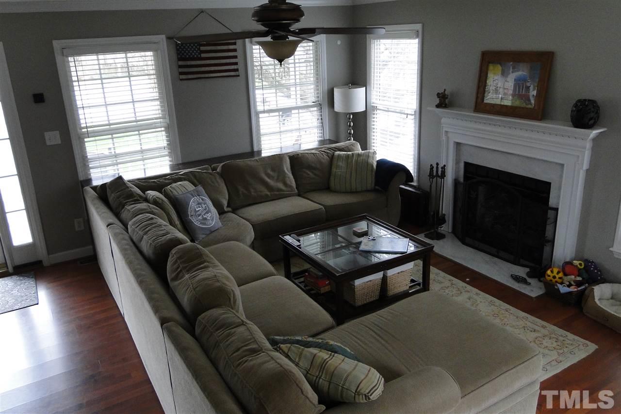4105 Landrum Lane Raleigh, NC 27616 - Photo 8 of 29 a living room with furniture and a fireplace
