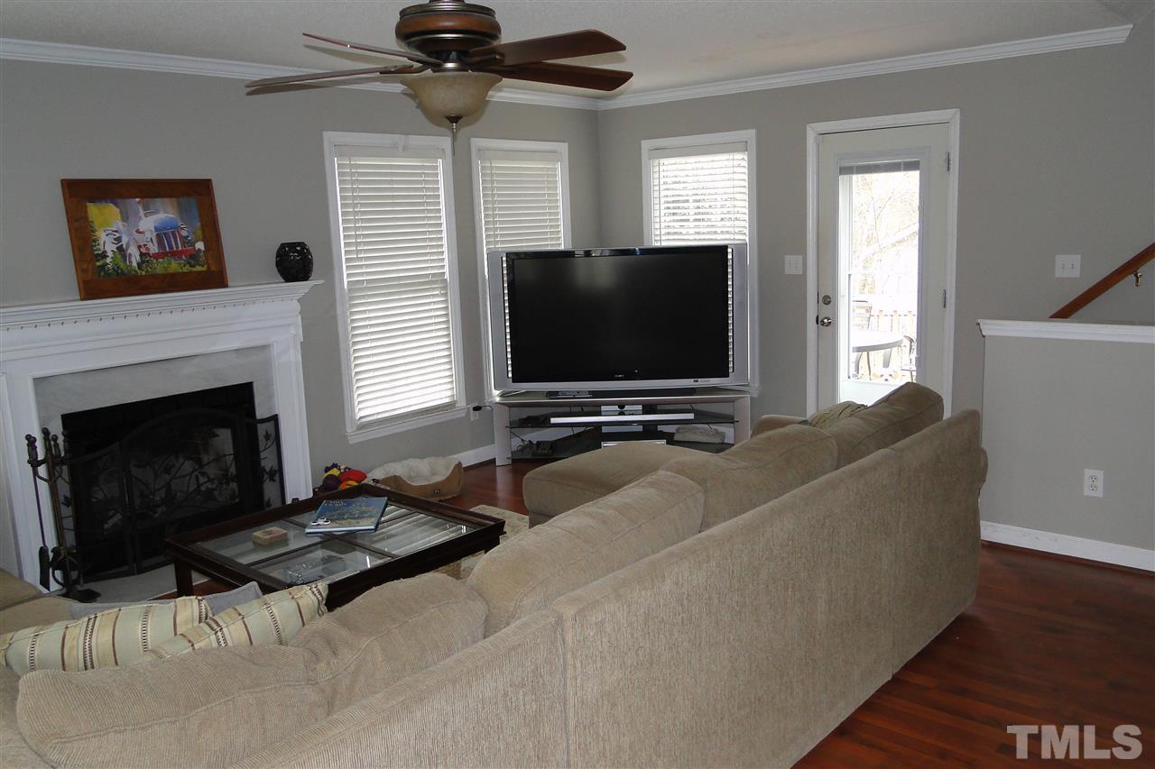 4105 Landrum Lane Raleigh, NC 27616 - Photo 9 of 29 a living room with furniture and a flat screen tv
