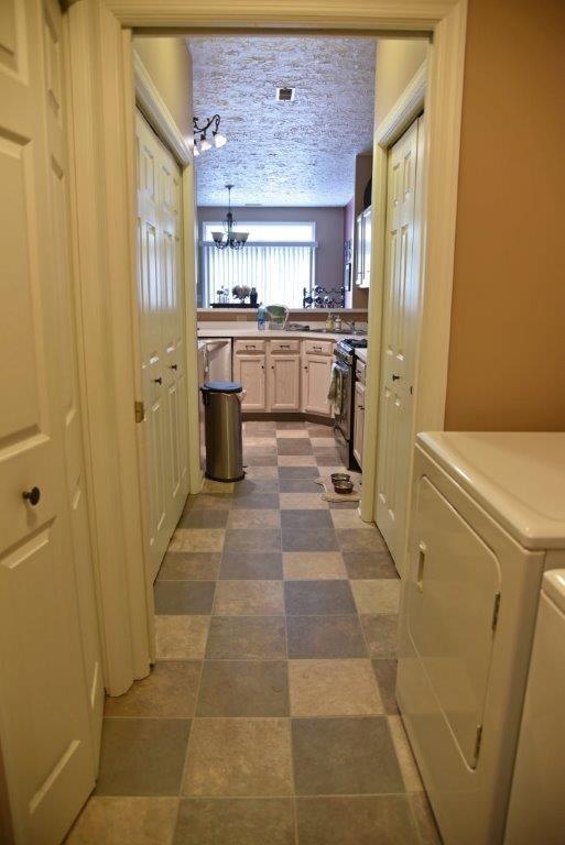 56 Stone Ridge Boulevard, Unit CONDO Hermitage, PA 16148 - Photo 12 of 14 Laundry room is between the kitchen and the garage