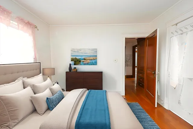 a bedroom with furniture and a rug