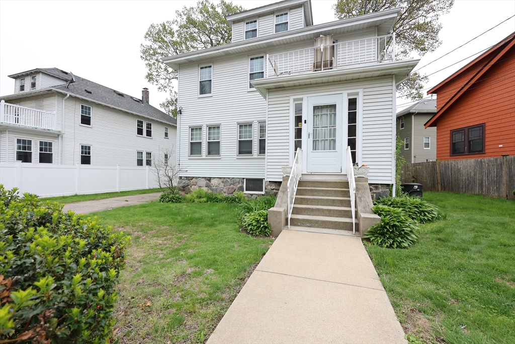 8 Verndale Road, Unit 2 Milton, MA 02186 - Photo 8 of 20 a front view of a house with a garden