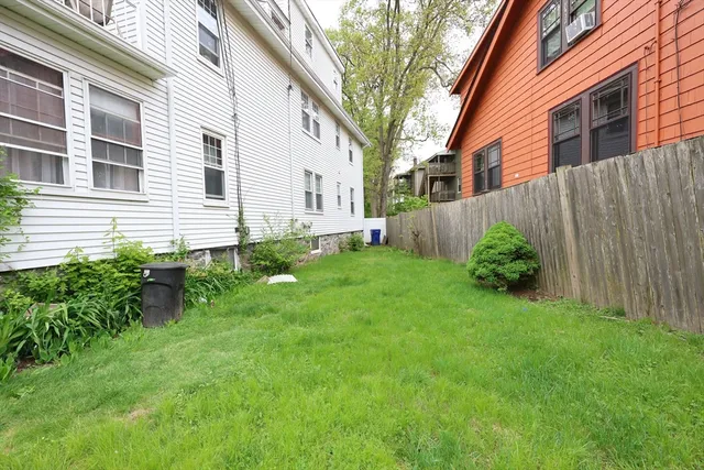a view of a house with a yard and plants