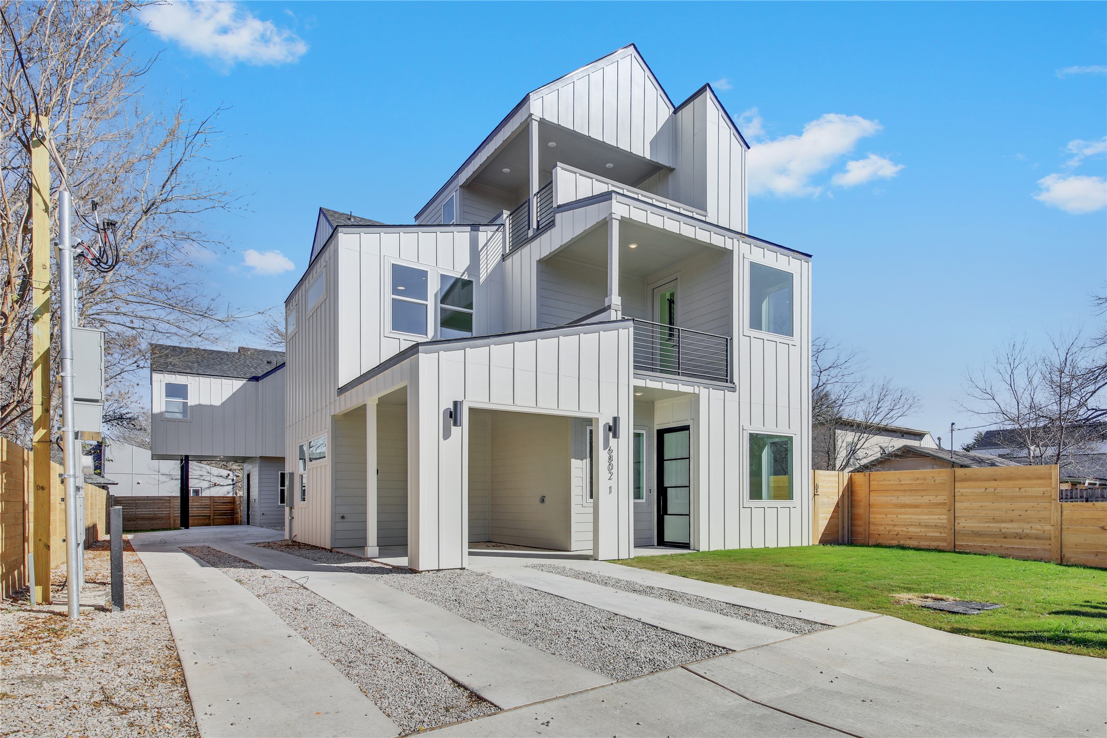 6802 Montana Street, Unit 1 Austin, TX 78741 - Photo 1 of 20 View of front of home featuring board and batten siding and a balcony