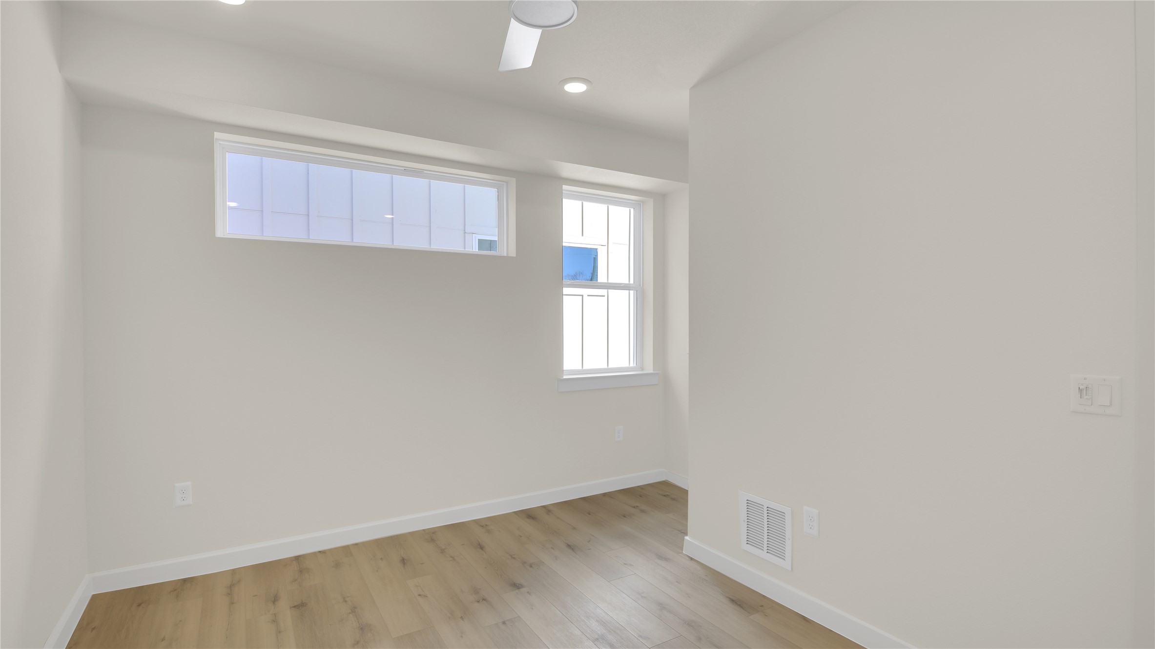 6802 Montana Street, Unit 1 Austin, TX 78741 - Photo 12 of 20 Unfurnished room featuring light wood-type flooring and recessed lighting