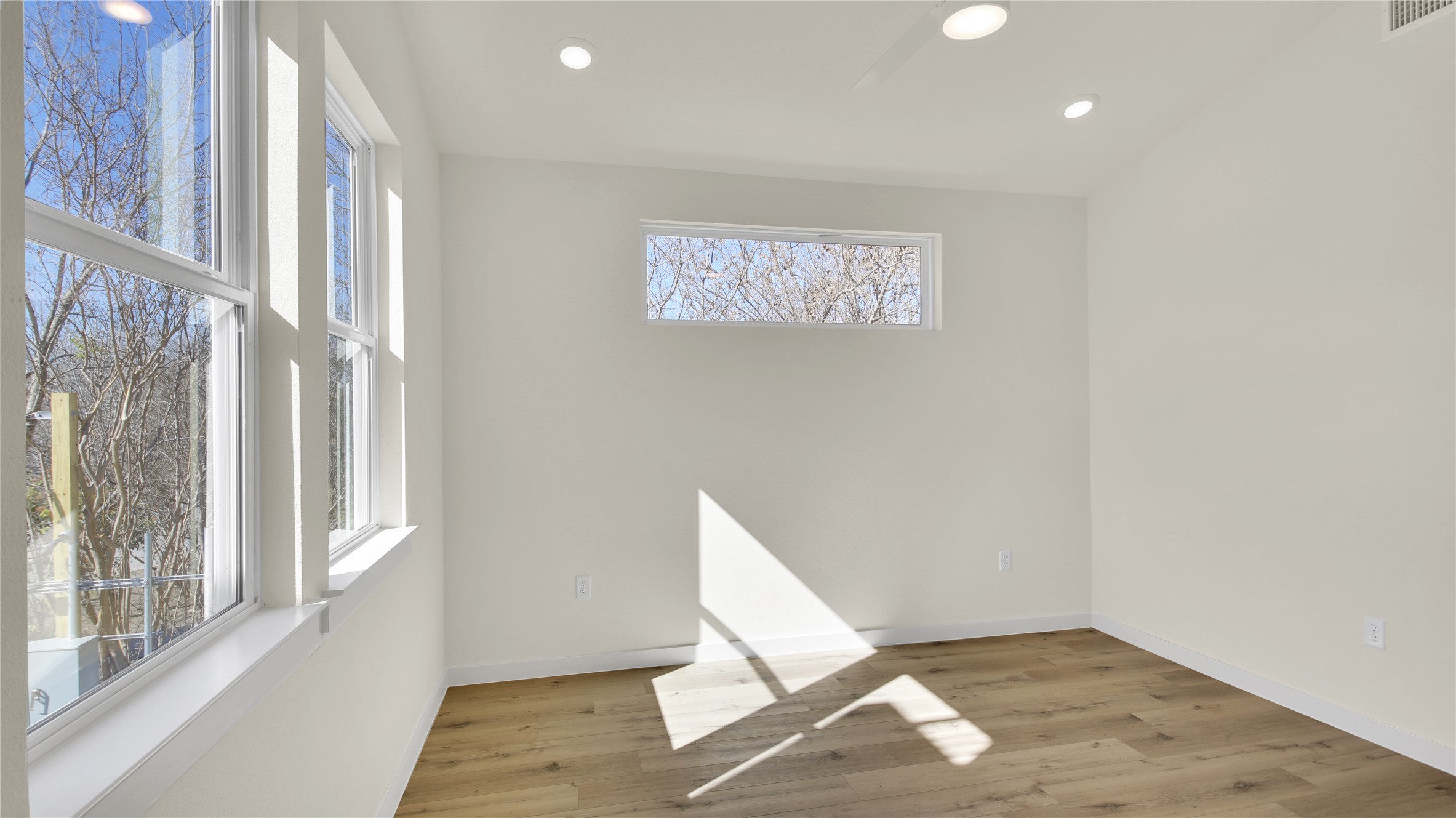 6802 Montana Street, Unit 1 Austin, TX 78741 - Photo 13 of 20 Unfurnished room with light wood-style floors and recessed lighting