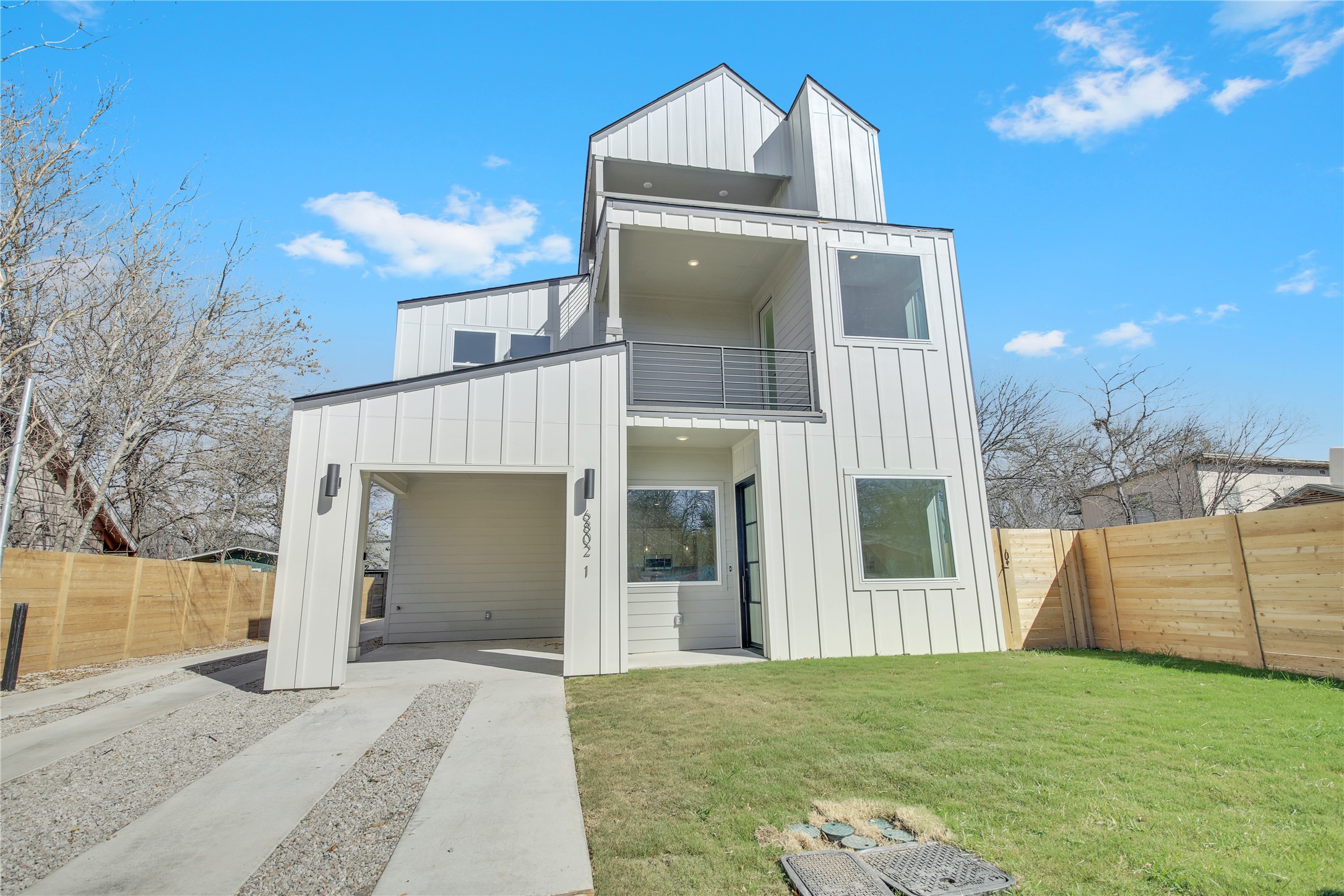 6802 Montana Street, Unit 1 Austin, TX 78741 - Photo 2 of 20 View of front of home featuring board and batten siding and a balcony