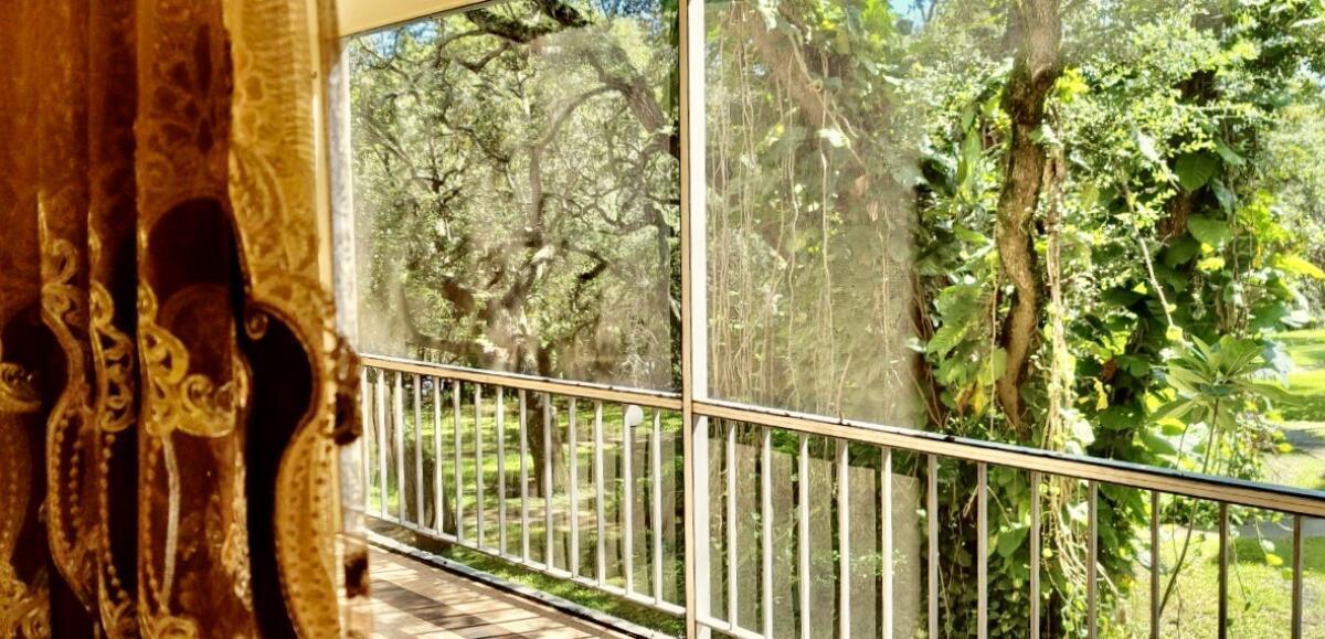 610 Northwest 13th Street, Unit 23 Boca Raton, FL 33486 - Photo 17 of 28 a view of a balcony with wooden fence