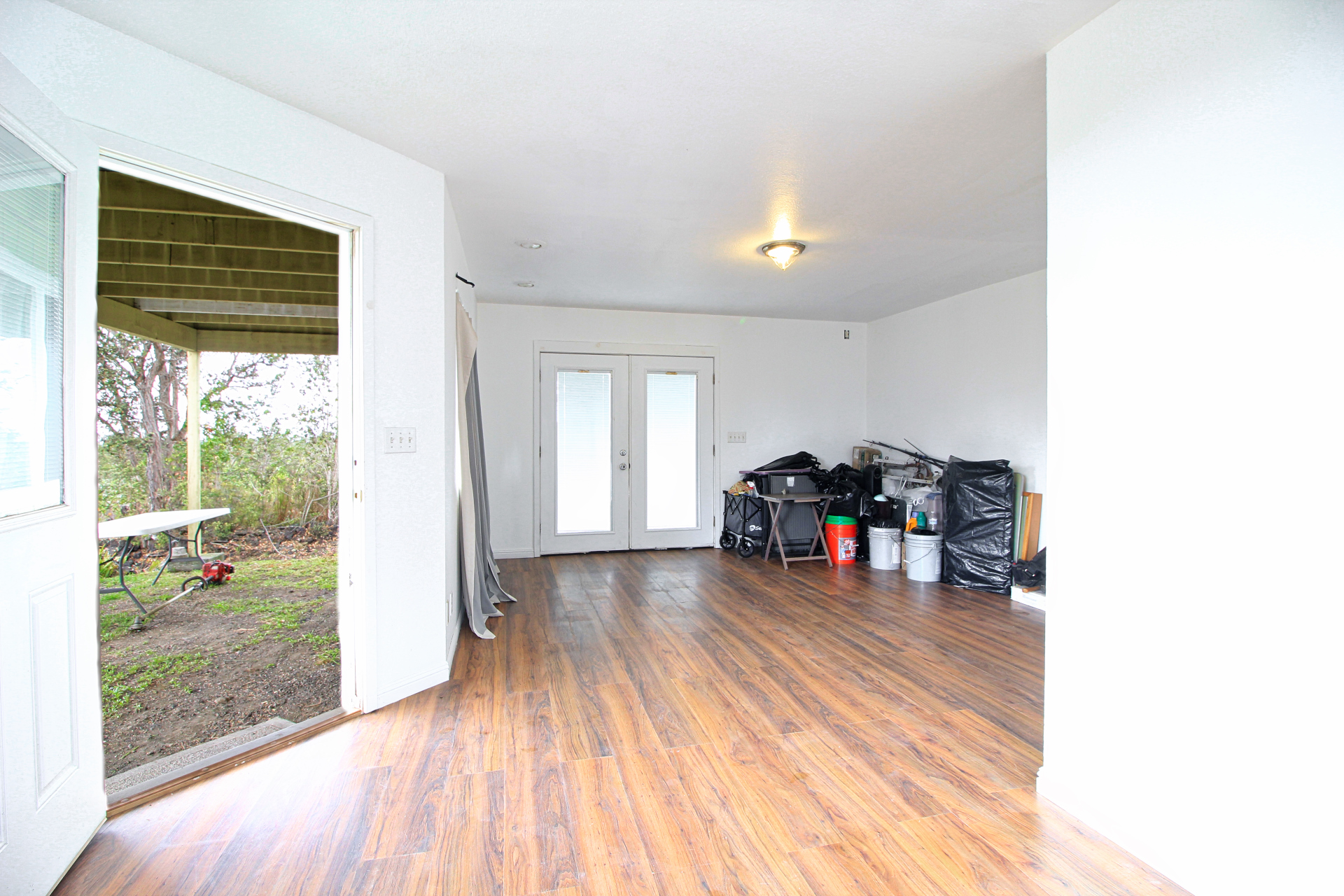 92-1435 Aloha Boulevard Ocean View, HI 96704 - Photo 19 of 28 a living room with furniture and a wooden floor