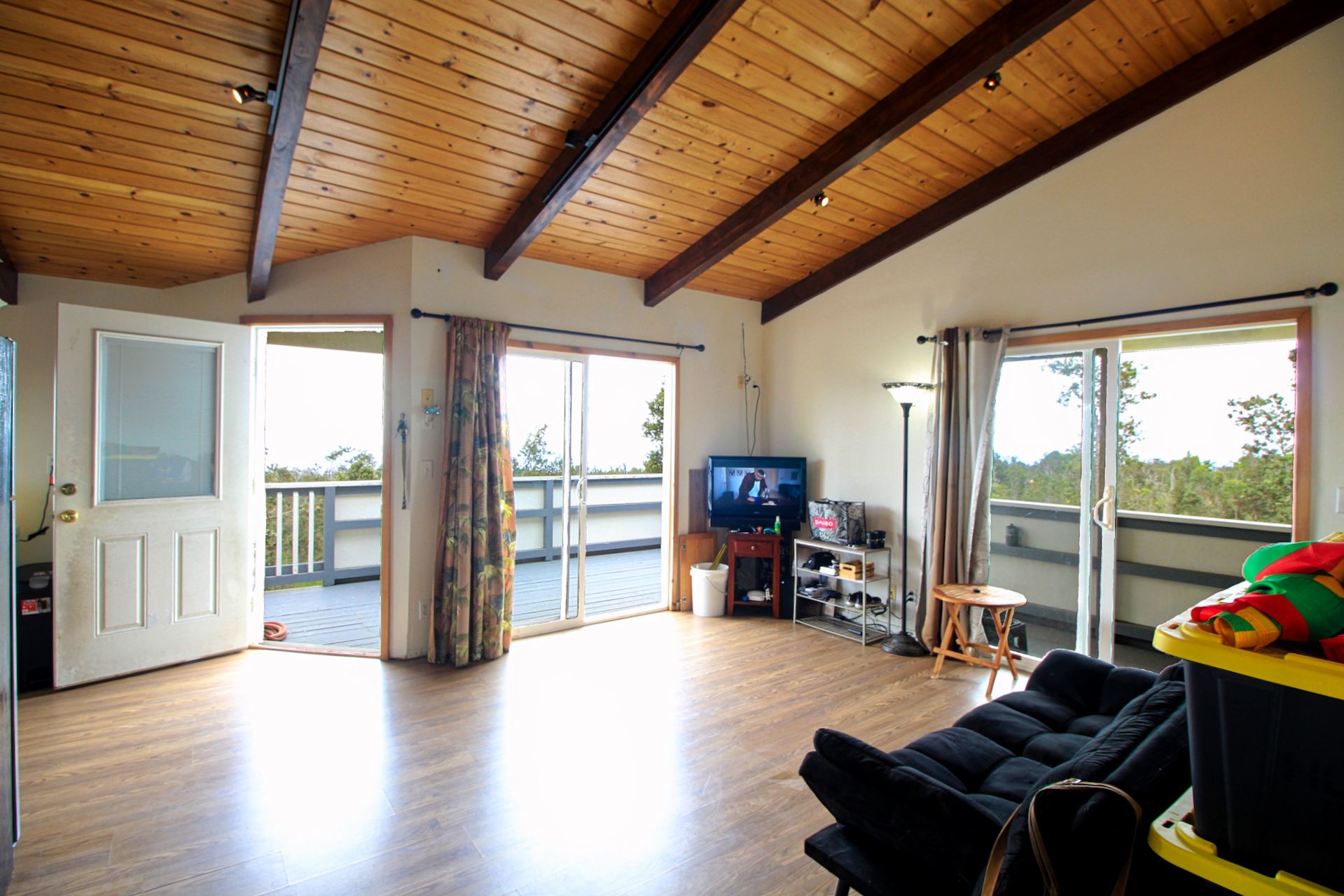 92-1435 Aloha Boulevard Ocean View, HI 96704 - Photo 27 of 28 a living room with furniture and a floor to ceiling window