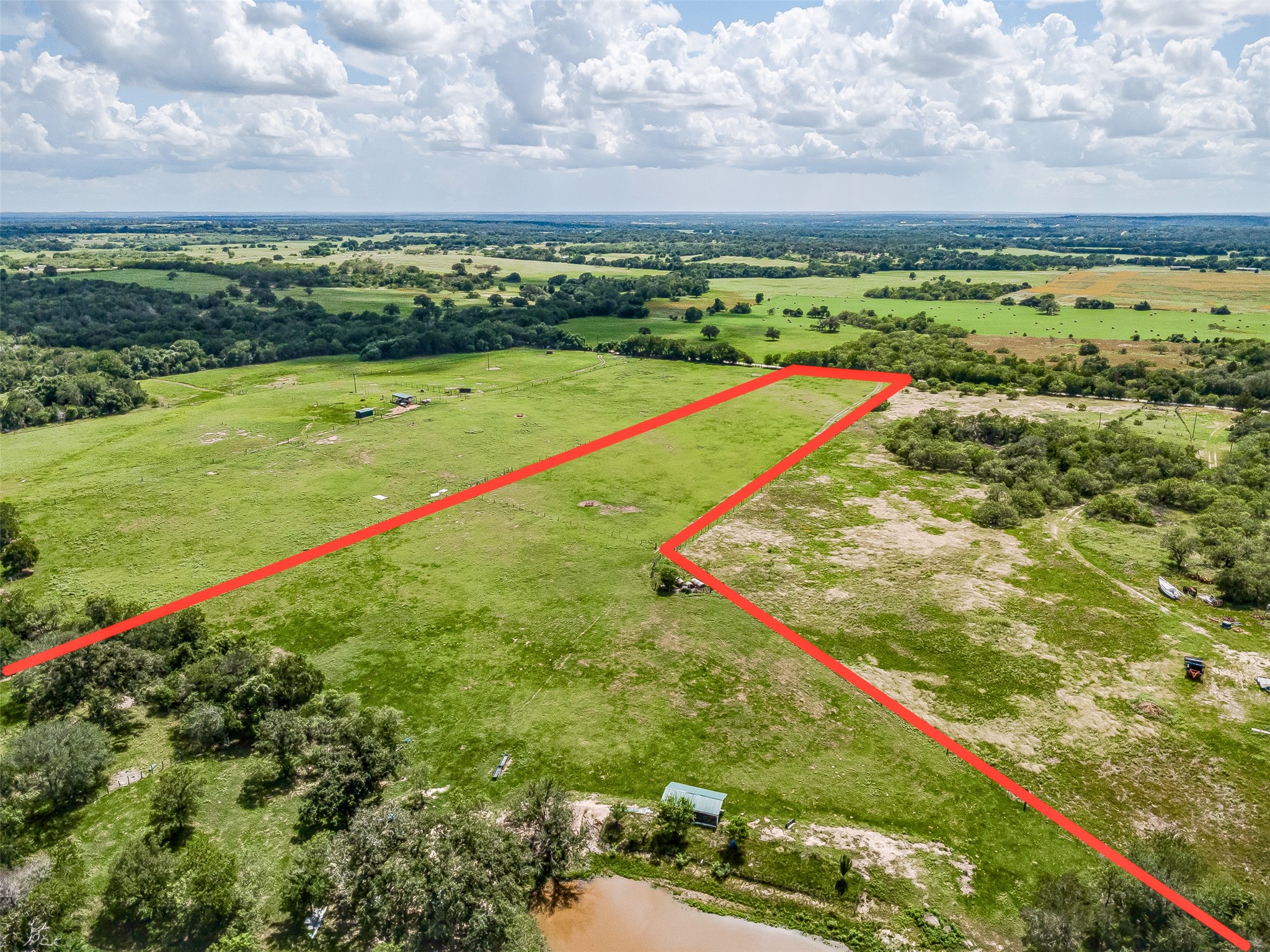 3109 Tenney Creek Road Dale, TX 78616 - Photo 2 of 23 View from the back of property to the front. Pond on the property is for livestock.