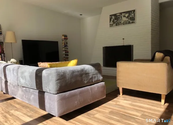 a bedroom with a bed and a television