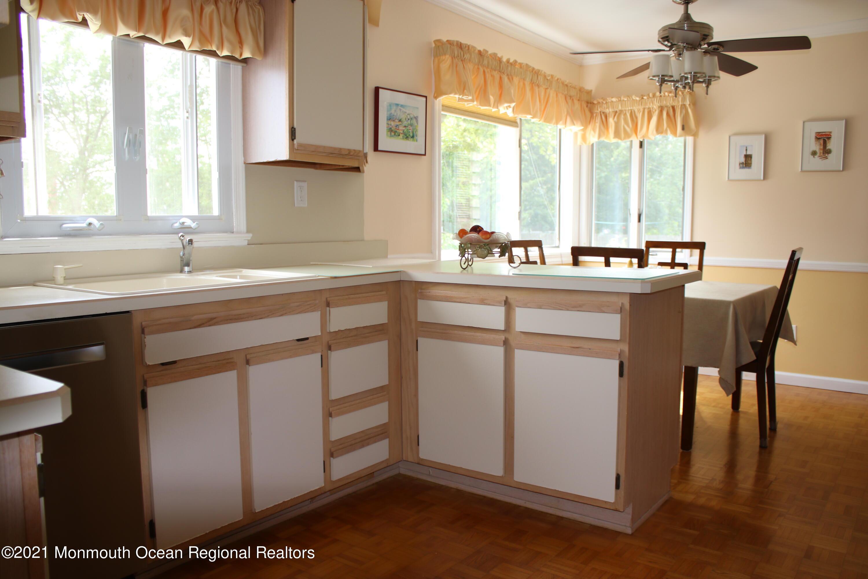 135 Lancaster Road Freehold, NJ 07728 - Photo 14 of 46 a kitchen with stainless steel appliances granite countertop a sink and a window