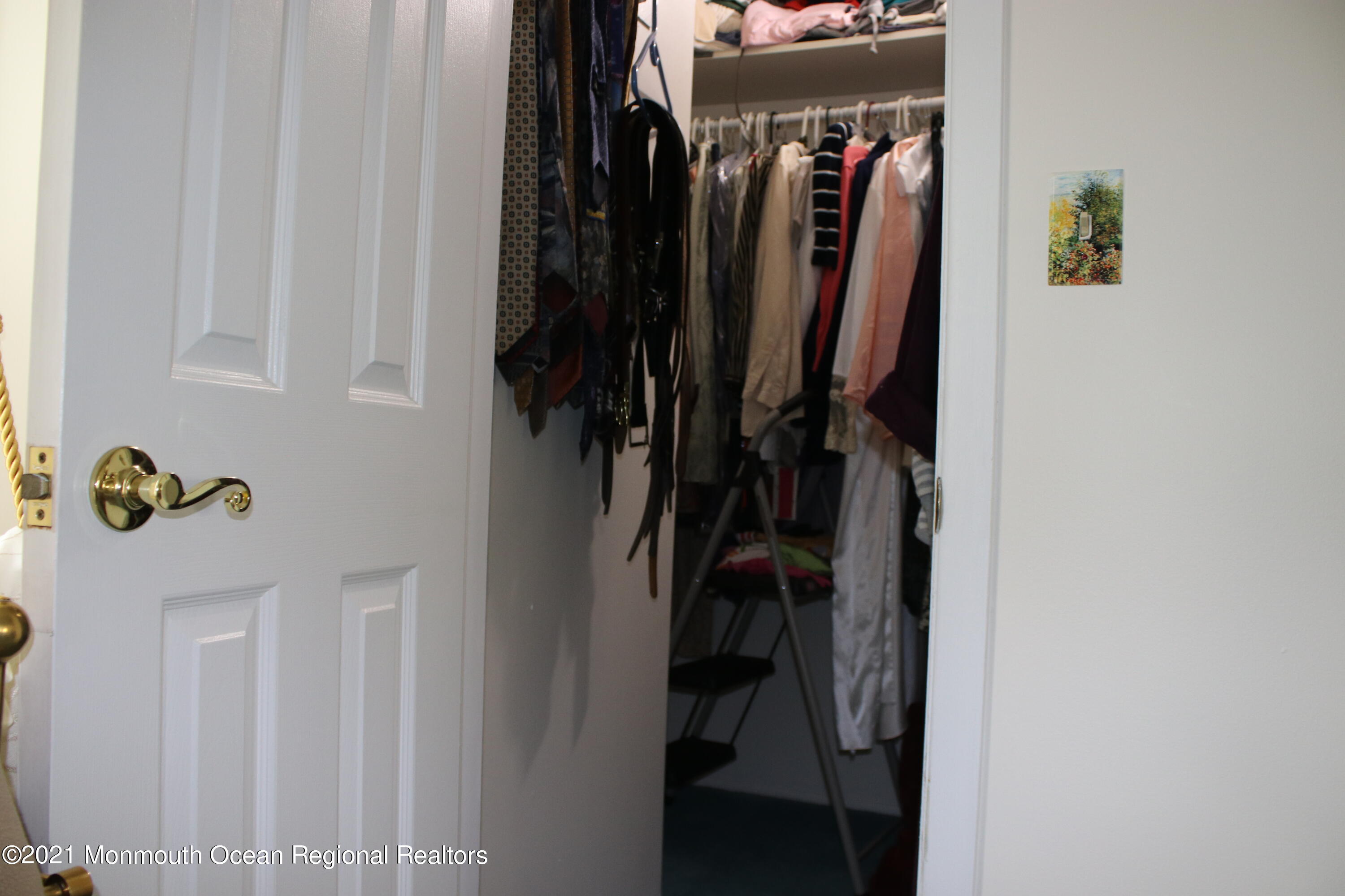 135 Lancaster Road Freehold, NJ 07728 - Photo 22 of 46 a view of walk in closet with clothes