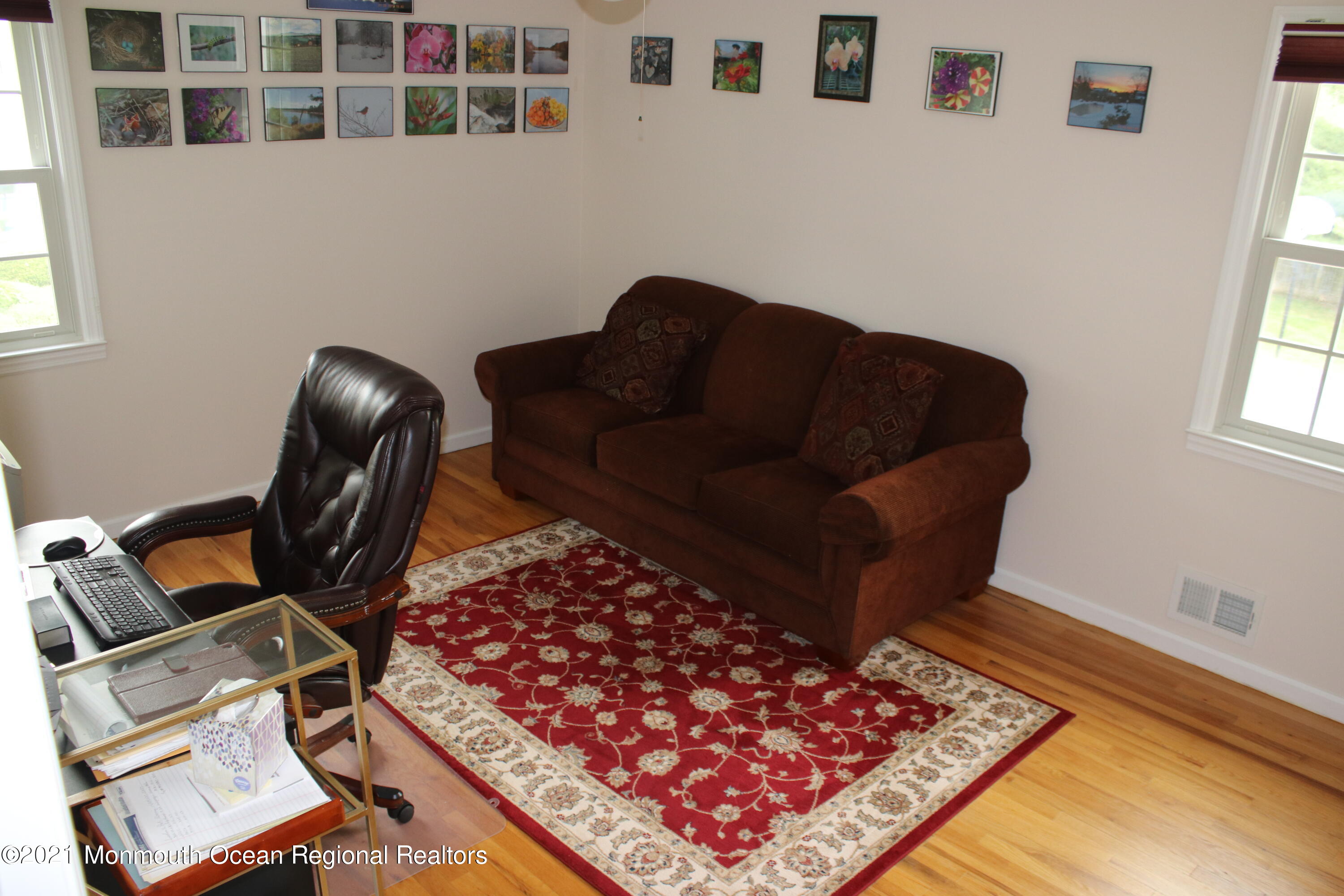 135 Lancaster Road Freehold, NJ 07728 - Photo 29 of 46 a living room with a couch and a window