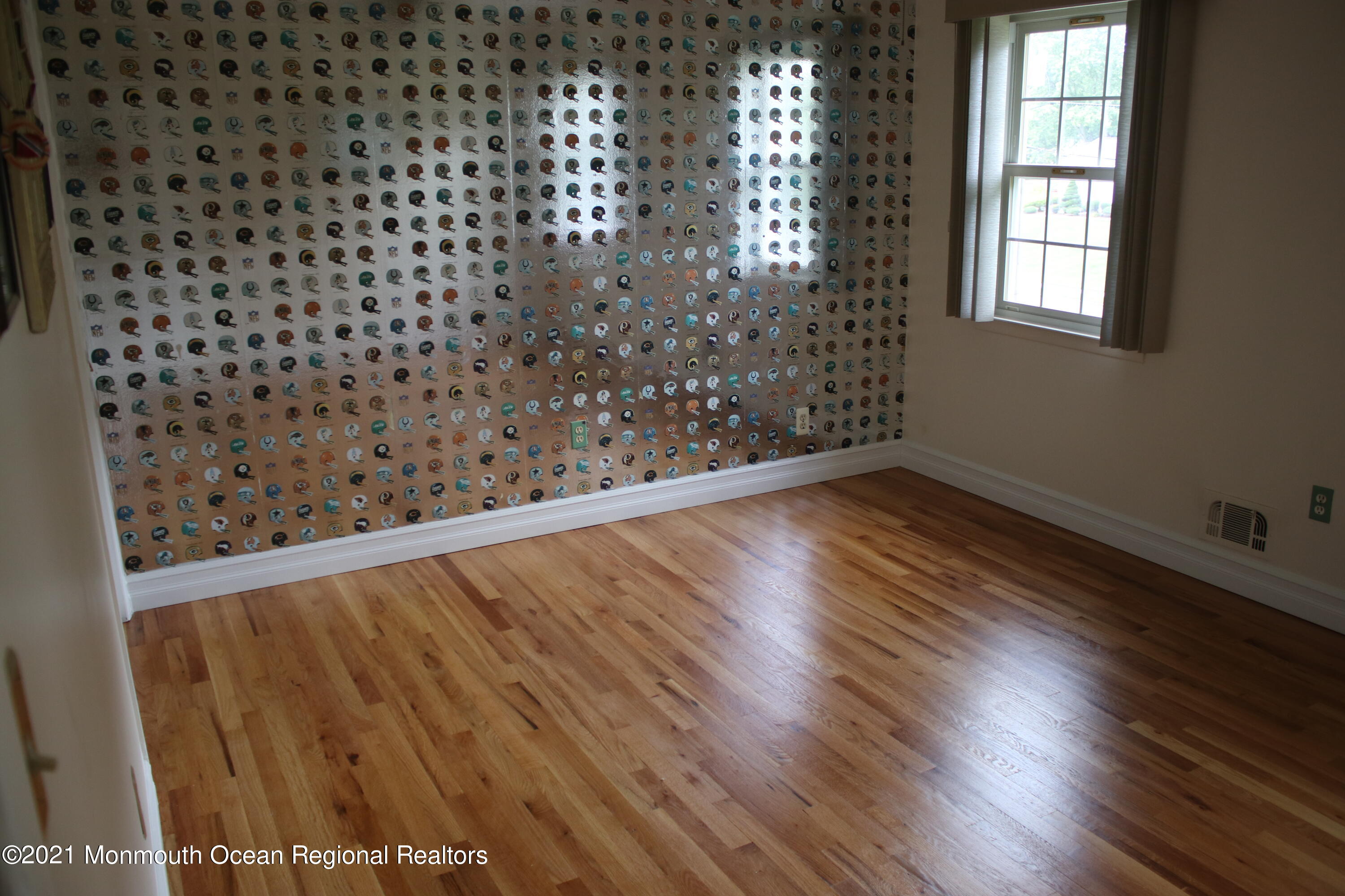 135 Lancaster Road Freehold, NJ 07728 - Photo 33 of 46 en empty room with wooden floor