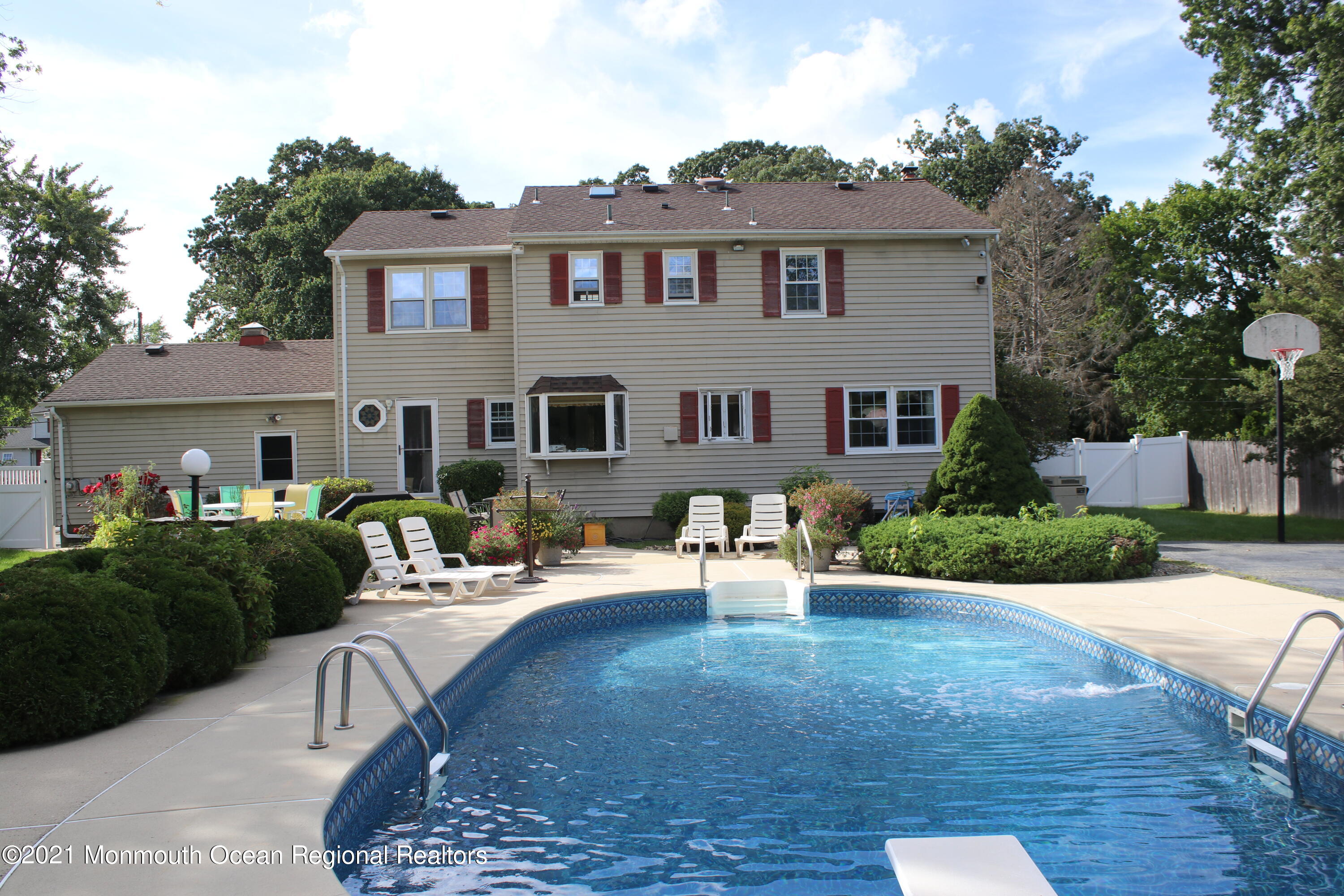 135 Lancaster Road Freehold, NJ 07728 - Photo 40 of 46 a view of a house with backyard sitting area and garden