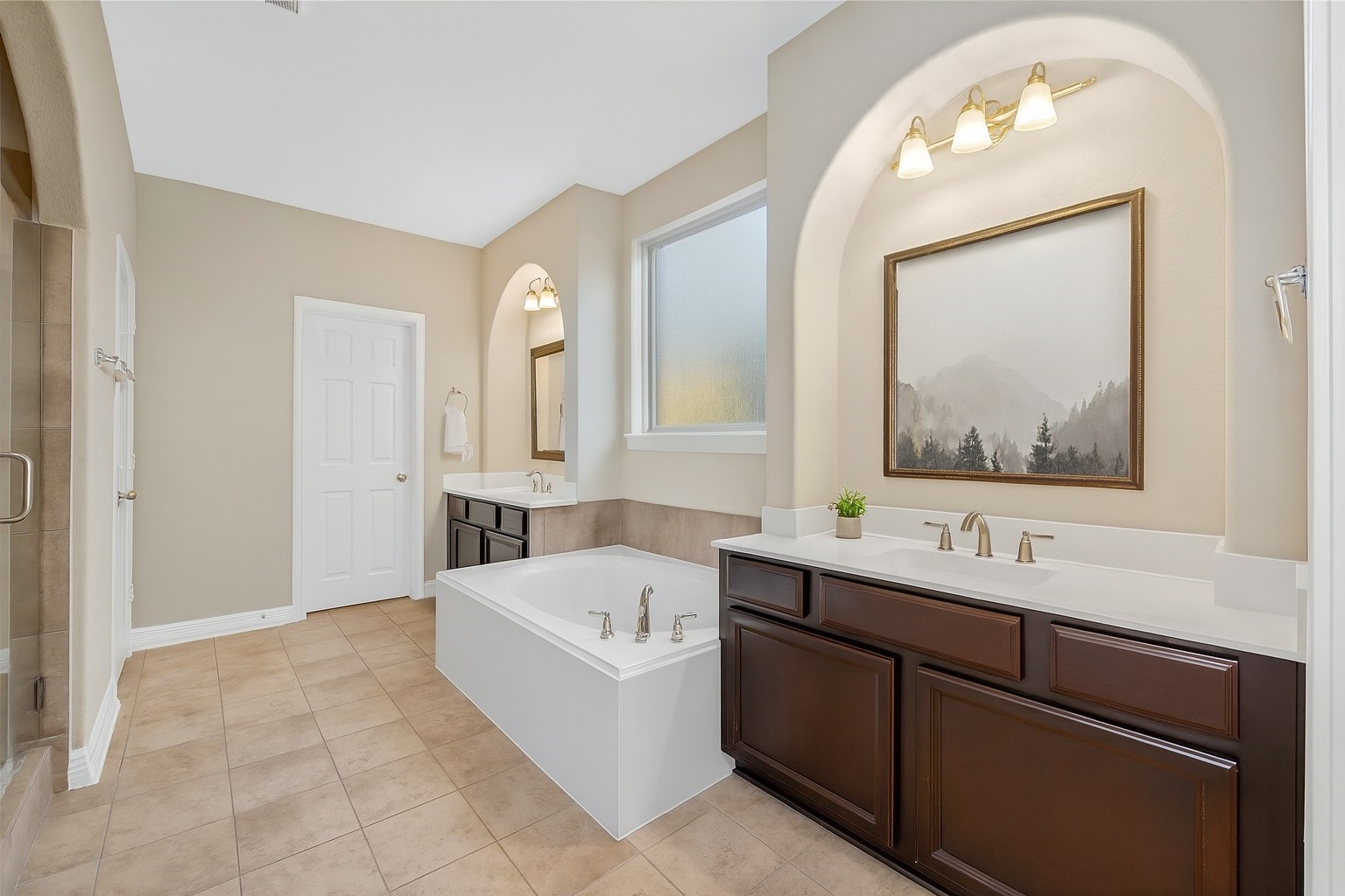 22743 Adrift Row Lane Porter, TX 77365 - Photo 18 of 33 a bathroom with a tub sink and mirror