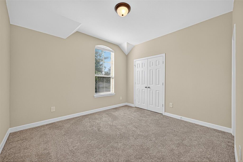 22743 Adrift Row Lane Porter, TX 77365 - Photo 22 of 33 an empty room with windows and closet