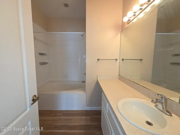 a bathroom with a tub and shower
