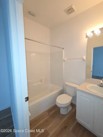 a bathroom with a toilet a sink and a bathtub